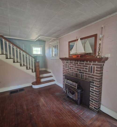fireplace for rehab, living room and stairway
