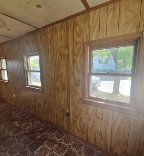wood panel to be removed and drywall put in